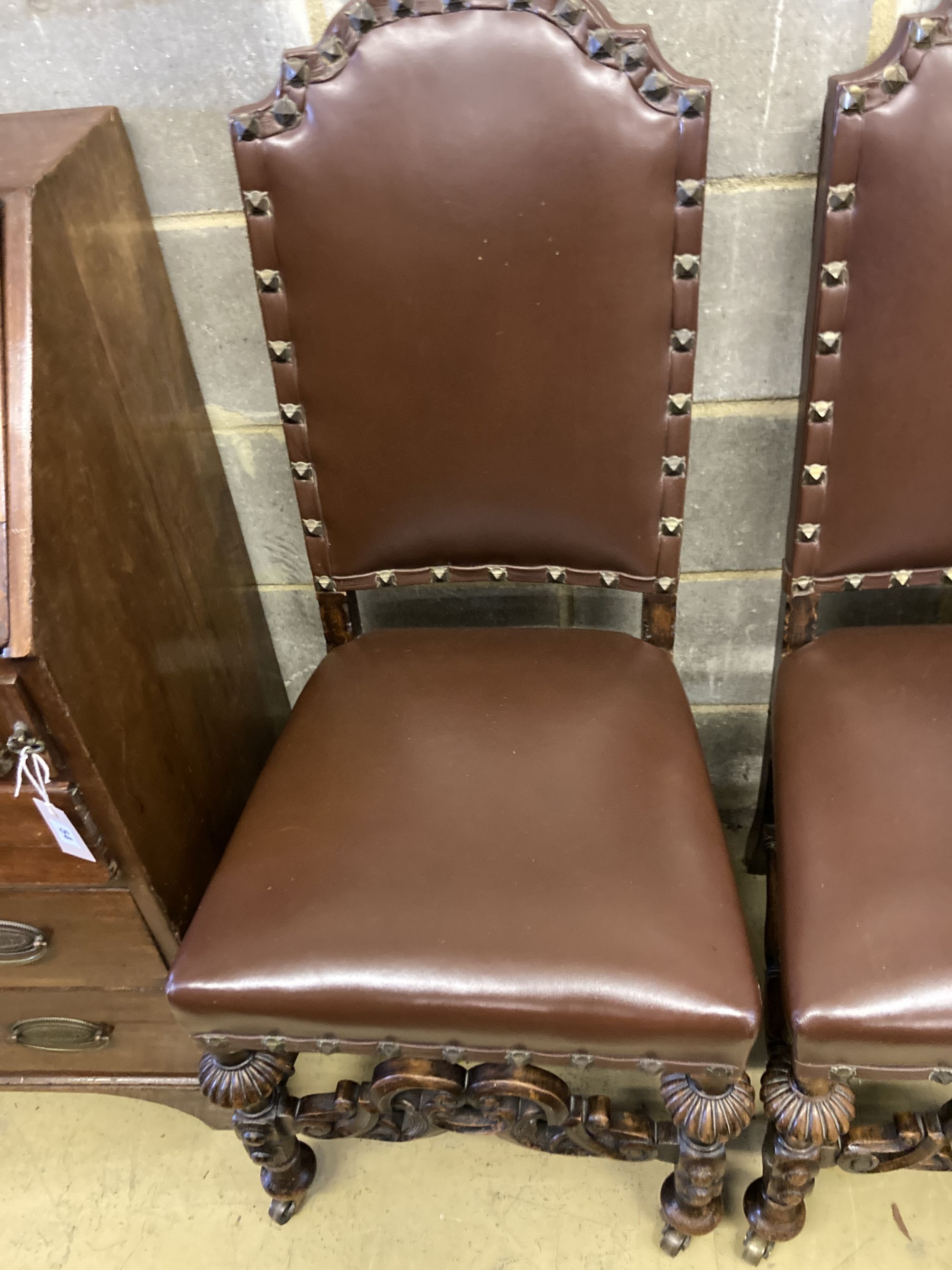 Two early 20th century oak Carolean design dining chairs by Waring & Son